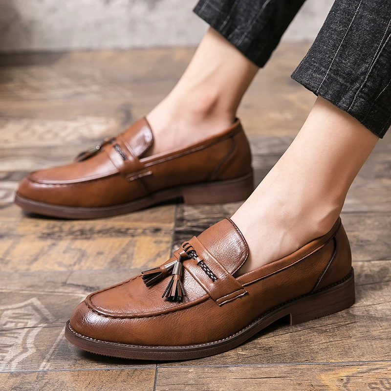 Loafers in Leather with pompons