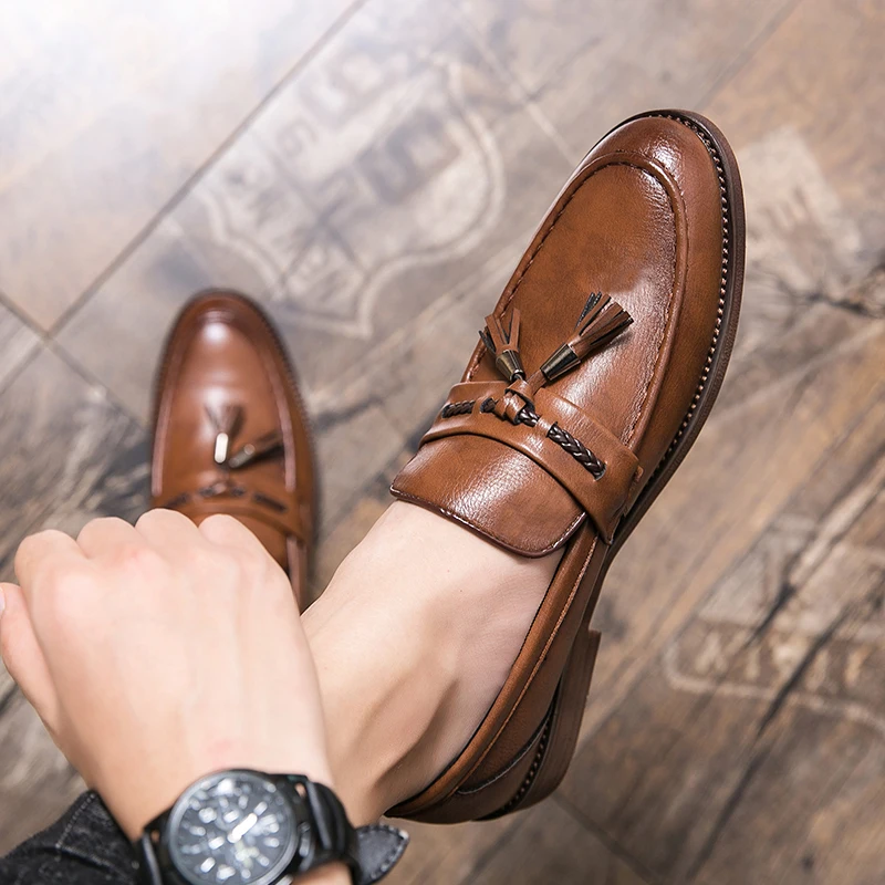 Loafers in Leather with pompons