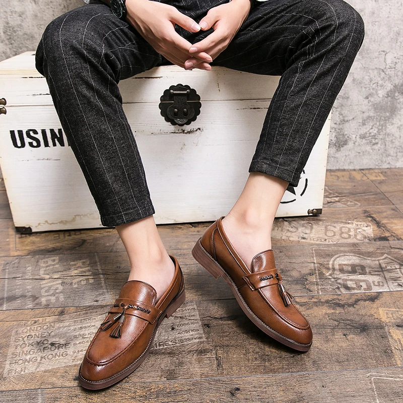 Loafers in Leather with pompons