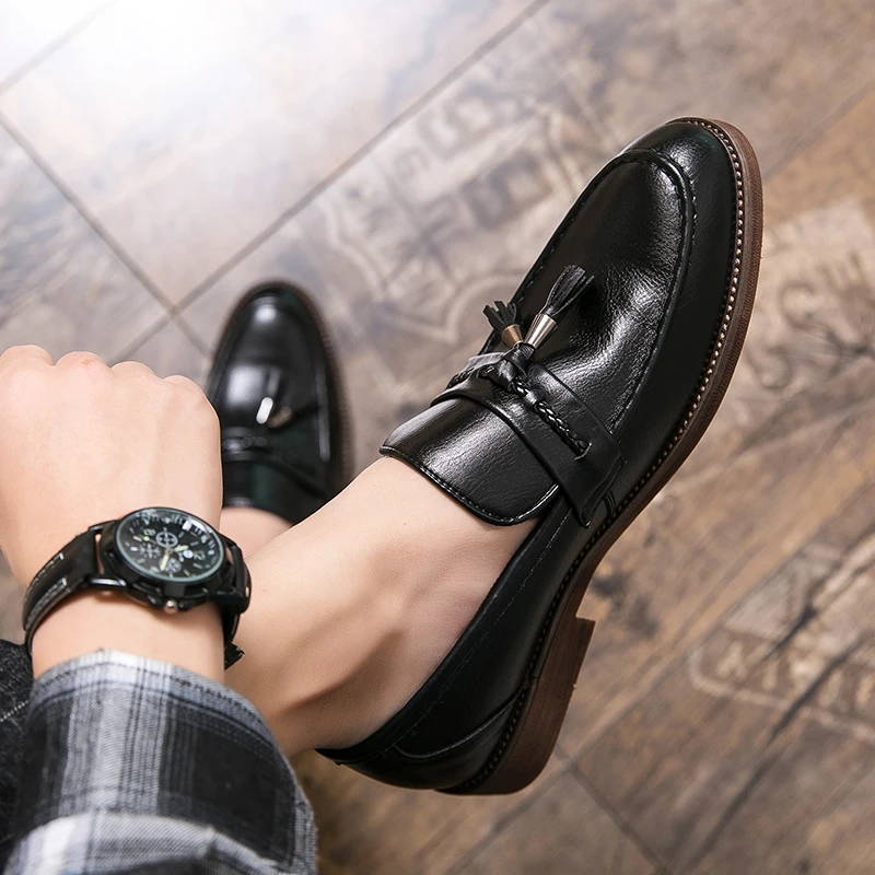 Loafers in Leather with pompons