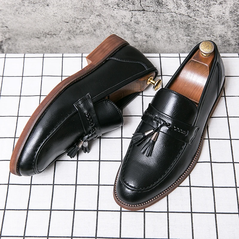 Loafers in Leather with pompons
