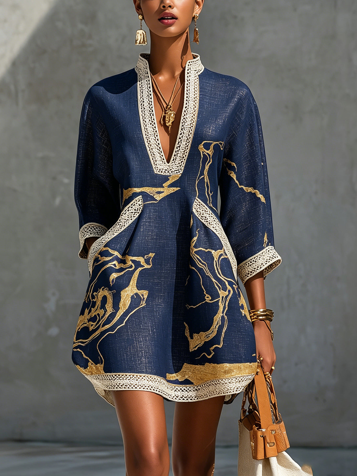 Donatella - Black mini dress with golden marble print and crochet lace