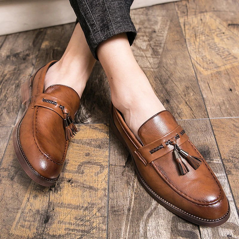 Loafers in Leather with pompons