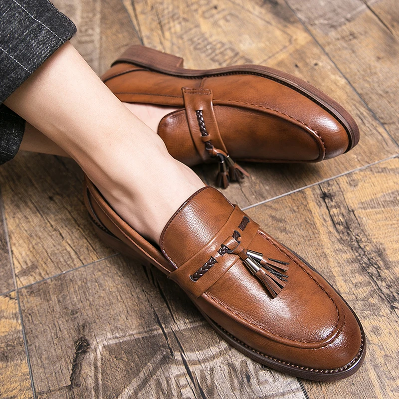 Loafers in Leather with pompons