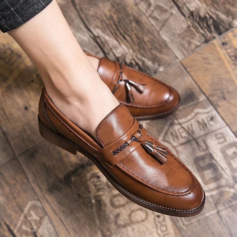 Loafers in Leather with pompons
