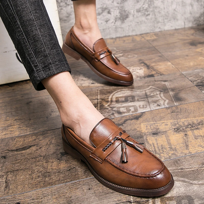 Loafers in Leather with pompons