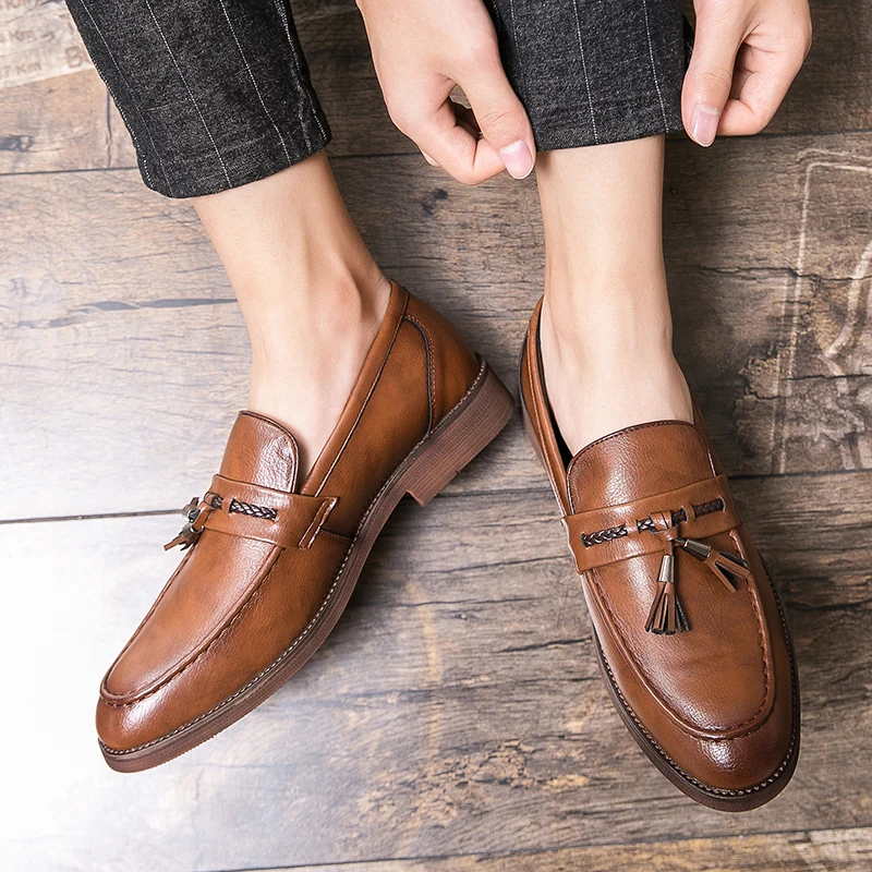 Loafers in Leather with pompons