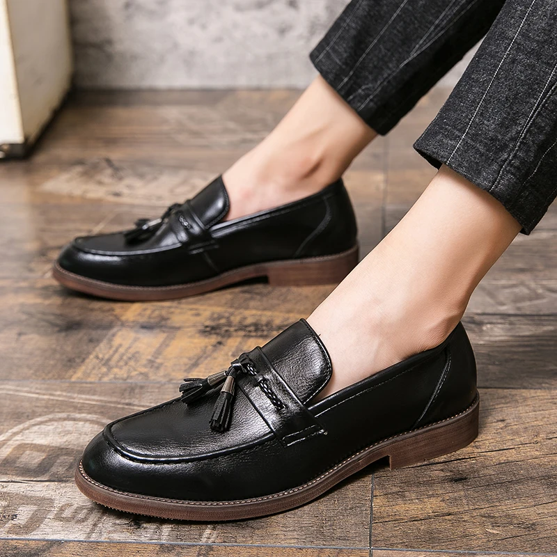 Loafers in Leather with pompons