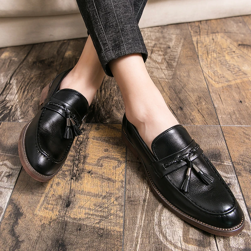 Loafers in Leather with pompons