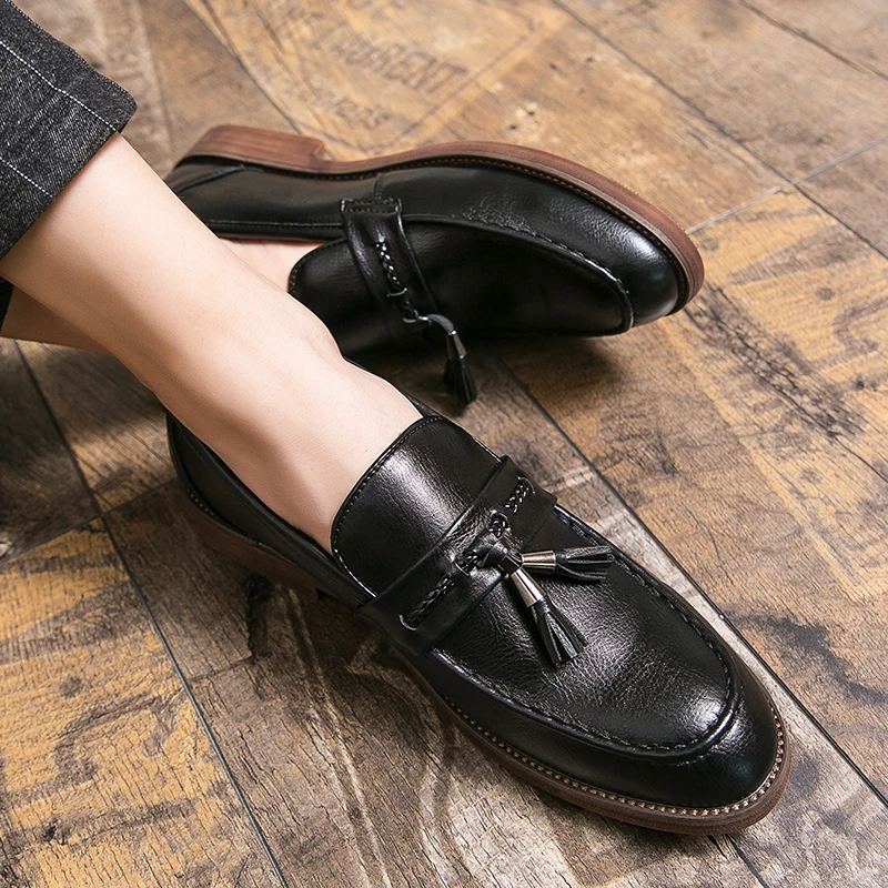 Loafers in Leather with pompons