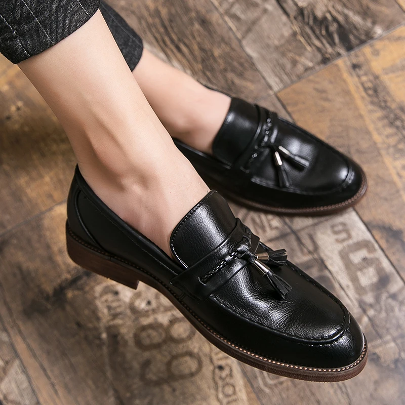 Loafers in Leather with pompons