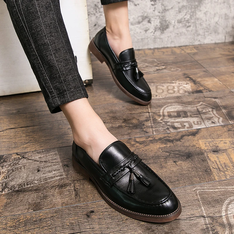 Loafers in Leather with pompons