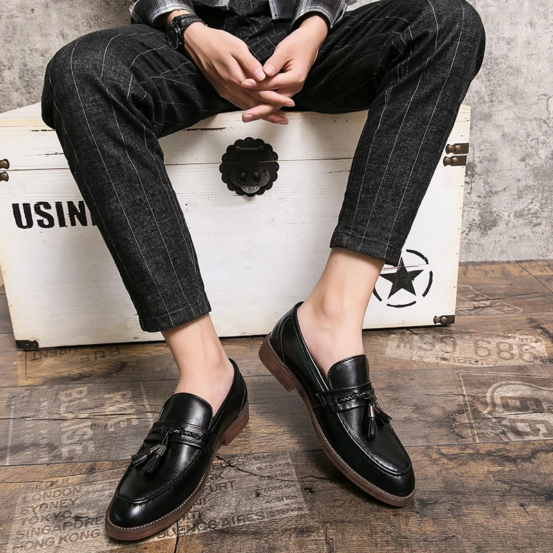 Loafers in Leather with pompons