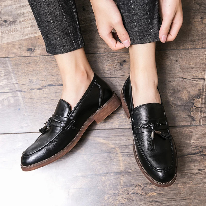 Loafers in Leather with pompons