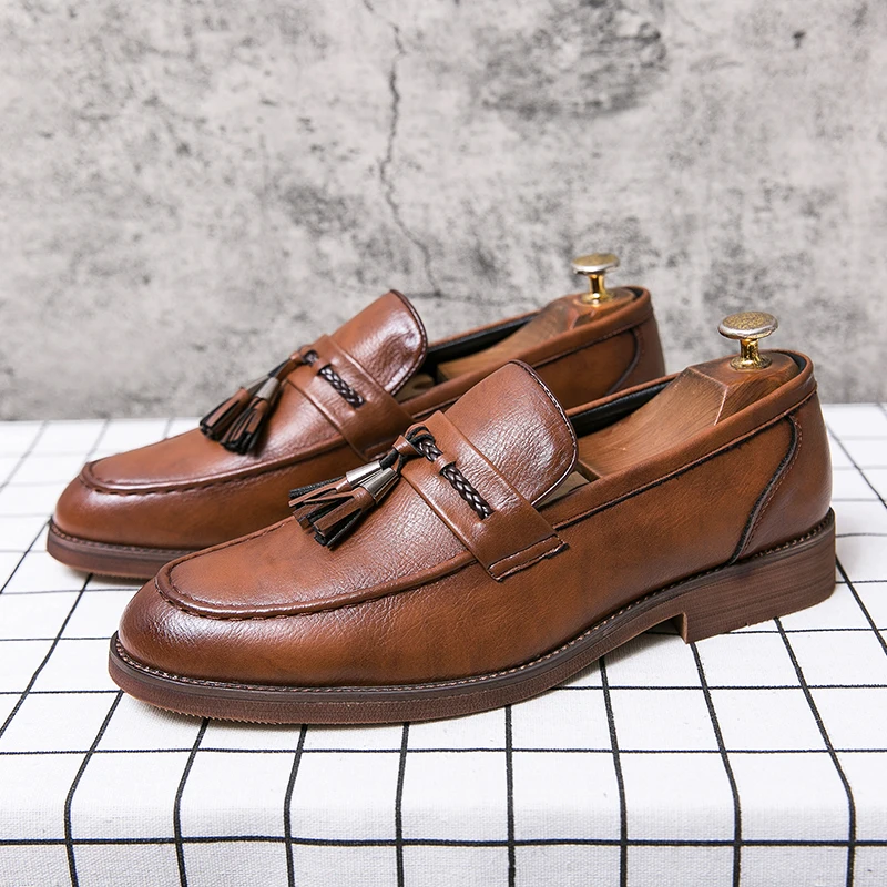 Loafers in Leather with pompons