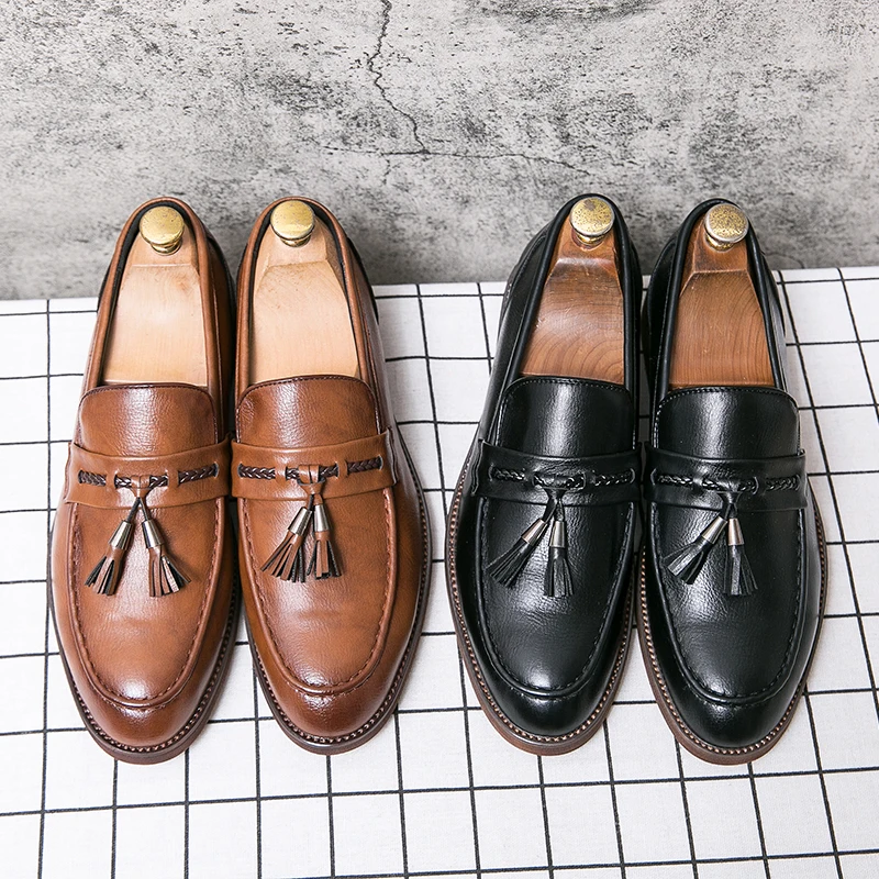 Loafers in Leather with pompons
